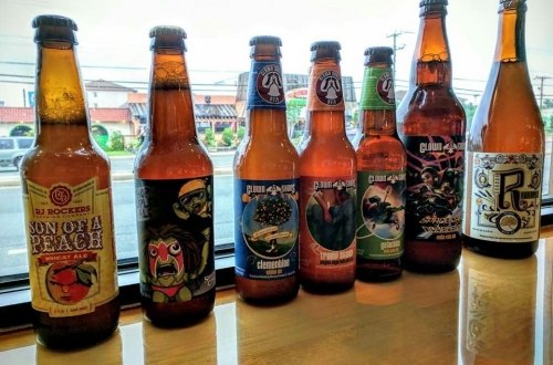 8 bottles of beer on a bar